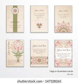 Set of six vertical business cards or tags. Oriental floral pattern on vintage background. Complied with the standard sizes. 