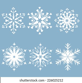 Set of six white snowflakes on a gray background