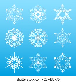 Set of six white snowflakes on a gray background