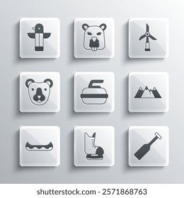 Set Skates, Paddle, Mountains, Stone for curling, Kayak, Bear head, Canadian totem pole and Wind turbine icon. Vector