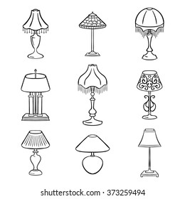 Set of sketched table lamps with lampshades. Vector illustration. Set of isolated black contoured objects on white background.