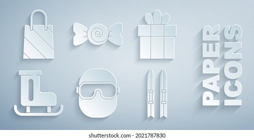 Set Ski goggles, Gift box, Figure skates, and sticks, Candy and Christmas shopping bag icon. Vector