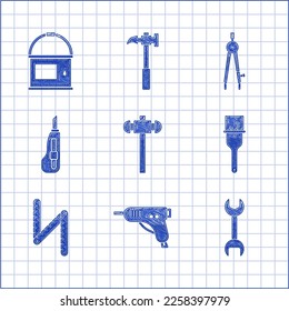 Set Sledgehammer, Electric hot glue gun, Wrench spanner, Paint brush, Folding ruler, Stationery knife, Drawing compass and bucket icon. Vector