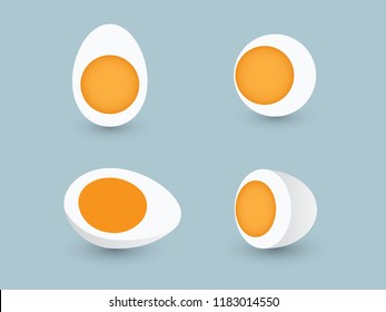 A set of sliced and half chicken eggs with yolk on blue background