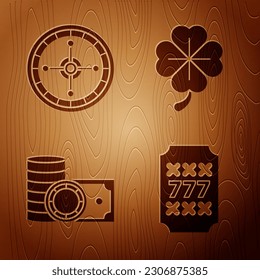 Set Slot machine with lucky sevens jackpot, Casino roulette wheel, Casino chips and stacks money cash and Four leaf clover on wooden background. Vector