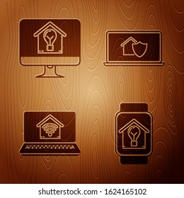 Set Smart watch with smart house and light bulb, Computer monitor with smart house and light bulb, Laptop with smart home with wi-fi and Laptop with house under protection on wooden background. Vector