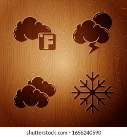 Set Snowflake, Fahrenheit and cloud, Cloud and Storm on wooden background. Vector