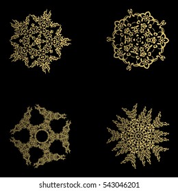 Set of snowflake for the new year. Collection of linear round figures, as the vintage ornament. Gold radial objects on the black background in vector. Decoration for christmas