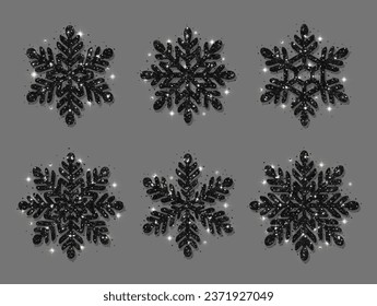 Set of snowflakes. Black glitter texture. Christmas decoration. Shining black snowflakes on a gray background.