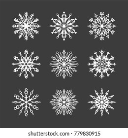 Set of snowflakes. Christmas elements on a black background. Vector illustration