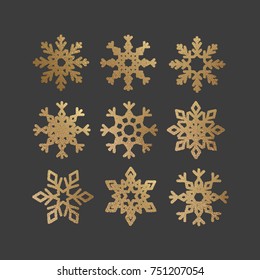 Set of Snowflakes with gold glitter texture. Christmas and New Year icons with shining sparkling light effect. Xmas vector illustration