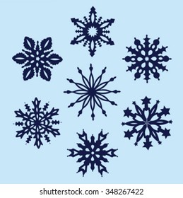 Set of snowflakes icons isolated on blue. Vector