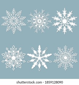 Set of snowflakes. Laser cut pattern for christmas paper cards, design elements, scrapbooking. Vector illustration.