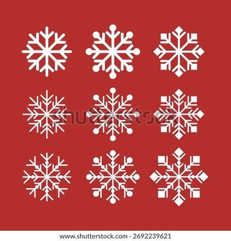 A set of snowflakes in various sizes and shapes are arranged in a row on a red background