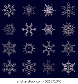 A set of snowflakes. Vector illustration. Snowflakes for home decoration for New Year holidays. Ice crystals. Christmas decoration on a blue background.