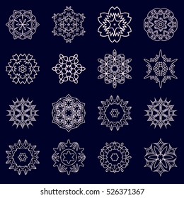 A set of snowflakes. Vector illustration. Snowflakes for home decoration for New Year holidays. Ice crystals. Christmas decoration on a blue background.