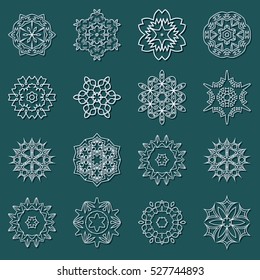 A set of snowflakes. Vector illustration. Snowflakes for home decoration for New Year holidays. Ice crystals. Christmas decoration on a blue background.