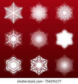 A set of snowflakes. White snowflakes on a red background - elements for design and advertising. A set of snowflakes for winter design.