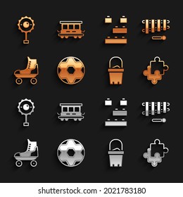 Set Soccer football ball, Xylophone, Puzzle pieces toy, Sand in bucket, Roller skate, Toy building block bricks, Rattle baby and Passenger train cars icon. Vector