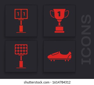 Set Soccer or football shoes with spikes, Sport football mechanical scoreboard and result display, Award cup and Bright stadium lights icon. Vector