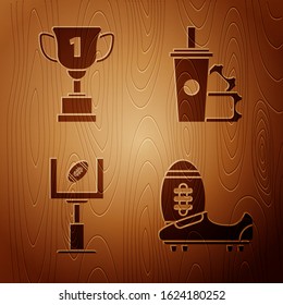 Set Soccer or football shoes with spikes, Award cup, American football goal post and football ball and American Football ticket and paper glass soda with drinking straw on wooden background. Vector