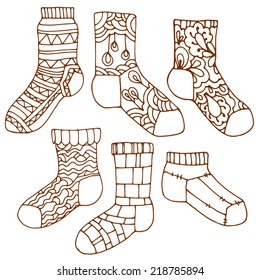 Set of socks with ornament. Stylized socks with different patterns. Brown contour, hand-drawn design elements.