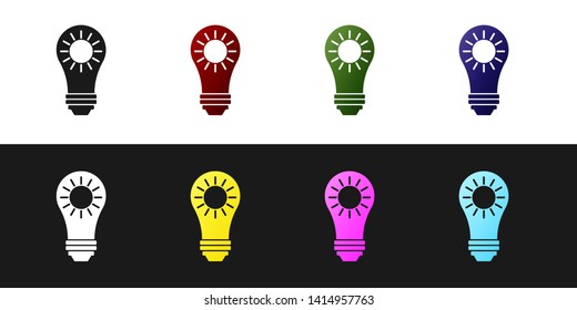 Set Solar energy panel icon isolated on black and white background. Sun and light bulb. Vector Illustration