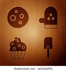 Setze Spatula , Keks oder Kekse mit Schokolade , Cupcake und Ovenhandschuh auf Holzhintergrund. Vektorillustration