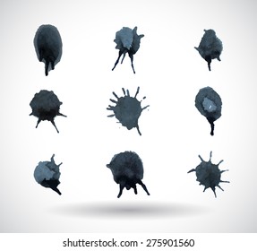 Set of splashes and blots black silhouettes on the white background. Vector illustration