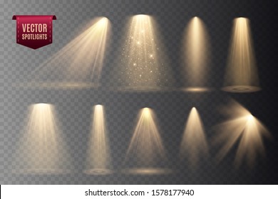 Set of Spotlight isolated on dark transparent background. Vector glowing light effect with gold rays and beams