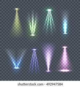 Set of spotlights rays. Vector illustration on transparent background. Yellow, green, blue, violet glowing upper and lower lights. Concert lighting, party, nightclub, advertising and city lights