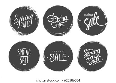Set of Spring Sale special offer tags with calligraphic text design and circle grunge style backgrounds for business, promotion and advertising. Hand drawn lettering. Vector illustration.