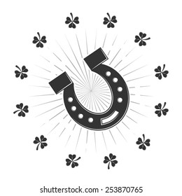 Set of St. Patrick's Day symbols. Horseshoe and shamrock clover. Vector monochrome scalable illustration for design.