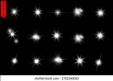 A set of star flares, shining light, a solar flare on a black background.