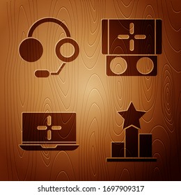 Set Star, Headphones, Laptop and Portable video game console on wooden background. Vector