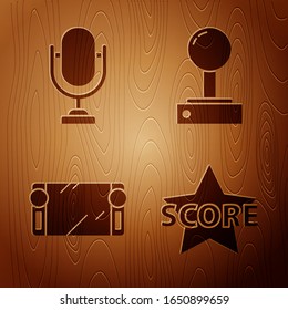 Set Star, Microphone, Portable video game console and Joystick for arcade machine on wooden background. Vector