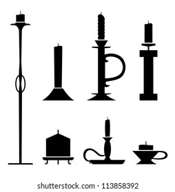 Set of stencil  candlesticks with candles. Icon collection of sconces black contour silhouettes