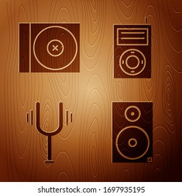 Set Stereo speaker, CD or DVD disk, Musical tuning fork and Music MP3 player on wooden background. Vector