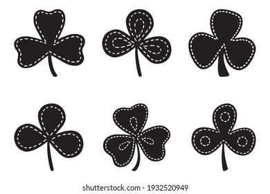Set of stiched clover or trefoil or shamrock leaves, St Patrick Day symbol. Silhouette vector illustrations isolated on the white background.