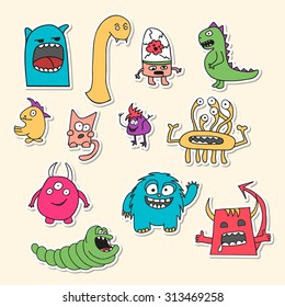 Set of stickers with doodle monsters in bright colors