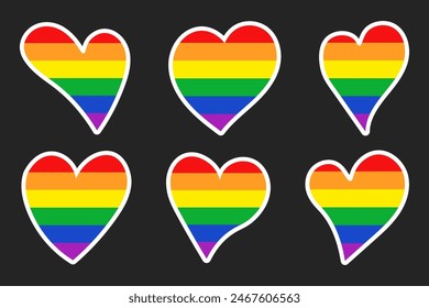 Set of stickers of rainbow hearts isolated on a dark background. Pride month stickers. Vector illustration