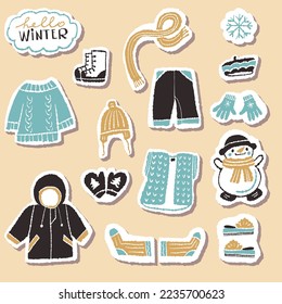 A set of stickers with warm winter clothes. Vector illustration
