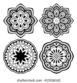 Set of stylized floral mandalas. Vector round ethnic ornaments. Template for embroidery.  Sketches for henna tattoo. Simple design for coloring books.