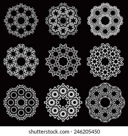 Set of stylized images of flowers. Vector illustrations isolated on a black background