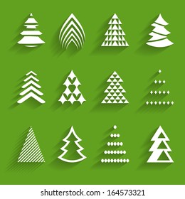 set of stylized paper fir trees on the green background