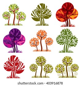 Set of stylized vector trees with green and purple leaves isolated on white background, ecology art decorative symbols collection. 