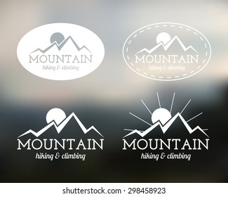 Set of Summer mountain camp badge, logo and label templates. Travel, hiking, climbing style. Outdoor. Best for adventure sites, travel company etc. On blurred background. Vector illustration