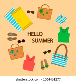 Set of summer things on a sand background, wicker bags, sandals, sunglasses, beach towels.