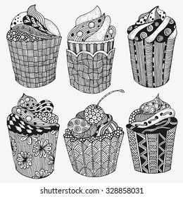 Set of  sweet cupcakes with chocolate, berries and cream. Artistically drawn, stylized.  Made by trace from sketch. Set of vector sketches. zentangle