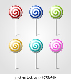 Set of sweet glossy lollipops isolated on light grey background